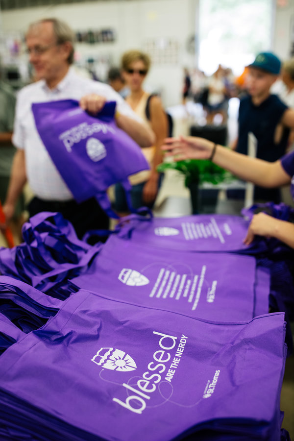 Volunteers hand out purple bags at the Minnesota State Fair on August 22, 2019 in St. Paul.