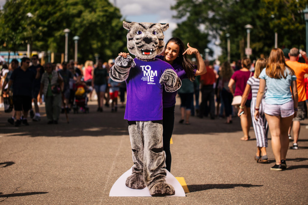 St. Thomas student Olivia Litecky poses with a Tommie cutout at the Minnesota State Fair