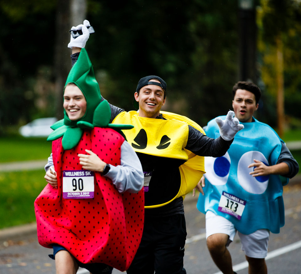 Runners in Pac-Man costumes head down Summit Avenue during the homecoming Wellness Center 5k October 7, 2017.