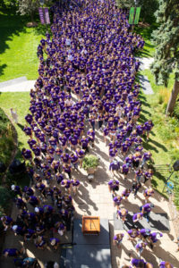 Incoming first-year students March Through the Arches.