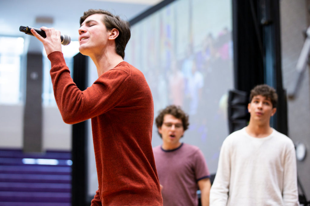 Members of a cappella group The Summit Singers give a performance for incoming freshman during a welcoming assembly in Shoenecker Arena.