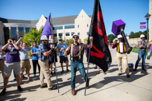 Members of “Caruso’s Crew” celebrate during the annual March through the Arches to celebrate the start of the school year and the arrival of a new class of freshmen on campus on September 3, 2019, in St. Paul.