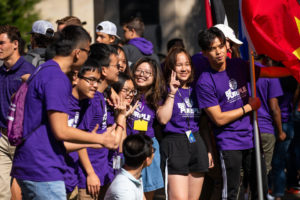 International students pose for a photo during the annual March through the Arches to celebrate the start of the school year and the arrival of a new class of freshmen on campus on September 3, 2019, in St. Paul.