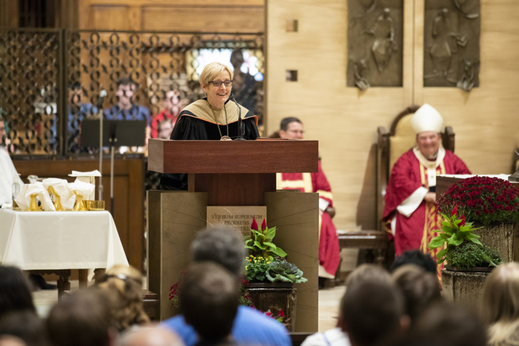 University president Julie Sullivan speaks during the Opening Mass Sept. 5, 2019 in the newly renovated interior of the Chapel of St. Thomas Aquinas.