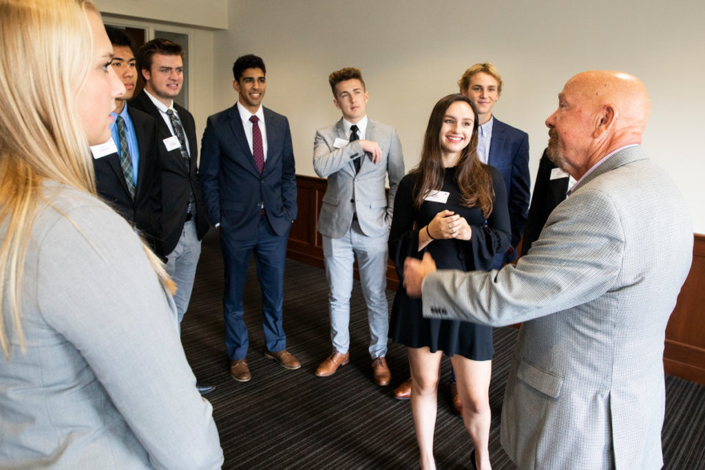 The fall of 2019 freshman class of Schulze Innovation Scholars chat with Dick Schulze following lunch in the Anderson Student Center.