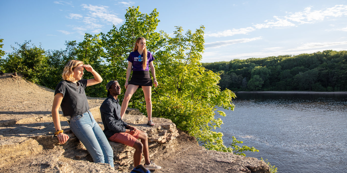 Students Sarah Benoy, Shukrani Nangwala and Mackenzie Stahl talk on the river bluffs overlooking the Mississippi River in Shadow Falls Park in St. Paul on June 13, 2019.
