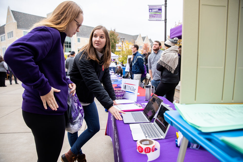 A student registers to vote during last year's homecoming event.