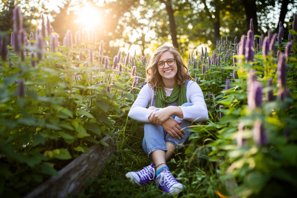 Portrait of student Emma Smith in the Stewardship Garden on the St. Paul campus.