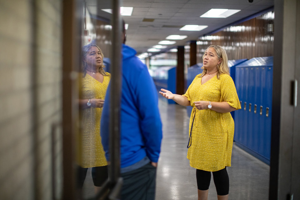 North High School Principal Marui Friestleben ’97, ’00 MA, ’05 EdS, talks to a coworker in North High on August 21, 2019 in St. Paul.