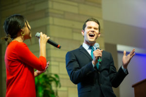 Danielle Wong and KSTP anchor Matt Belanger perform a duet at the ThreeSixty Journalism Great MN Media Get-Together in Woulfe Alumni Hall. Mark Brown/University of St. Thomas
