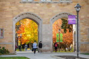 Students walk through the Arches on a beautiful fall day. Mark Brown/University of St. Thomas