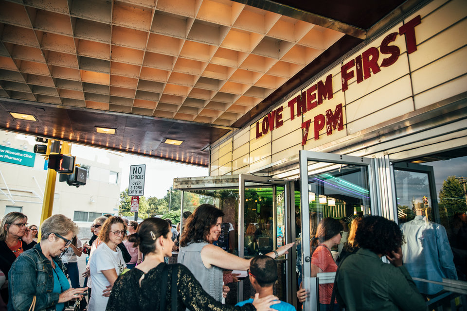 Movie goers line up to enter a screening of the documentary “Love Them First” at the Riverview Theater in south Minneapolis. 