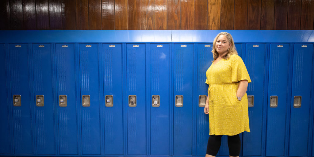 North High School Principal Marui Friestleben ’97, ’00 MA, ’05 EdS, poses for portrait in front of lockers in North High on August 21, 2019 in St. Paul.
