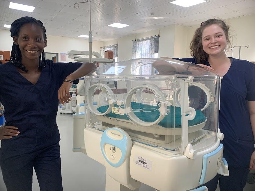 Pascale Kunda and Lauren, her lab partner, pose after repairing an incubator. 