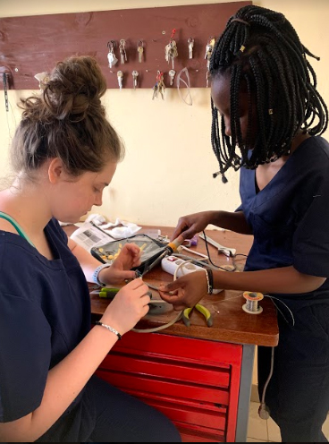 Pascale Kunda and Gabrielle, her lab partner, make repairs.