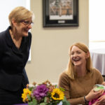 President Julie Sullivan talks with Social Work Professor Tonya Horn during a celebration of the naming of the Morrison Family College of Health in the Iversen Hearth Room. Mark Brown/University of St. Thomas