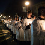 Seminarians process across the lower quad following a mass in the Chapel of St. Thomas Aquinas during the Borromeo Weekend Procession. Liam Doyle/University of St. Thomas