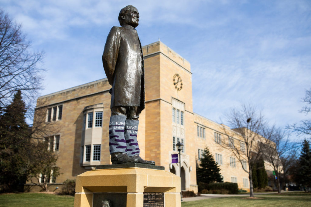 The John Ireland statue stands adorned with special socks to help celebrate and promote Tommie Give Day. Liam Doyle/University of St. Thomas