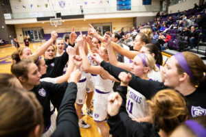 The St. Thomas women’s basketball team cheers together before a game against Augsburg College. Liam Doyle/University of St. Thomas