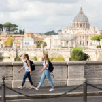 Students walk together to class from the Bernardi campus building in Rome, Italy with St. Peter’s Basilica visible in the background. Liam James Doyle/University of St. Thomas