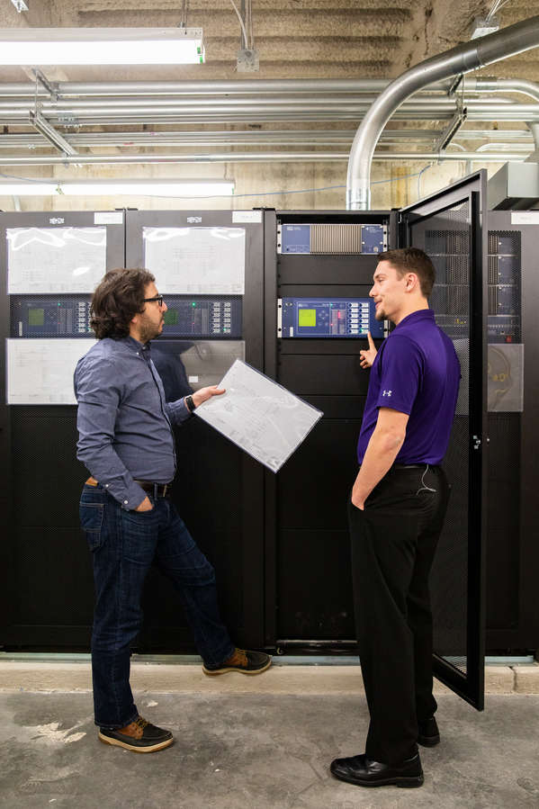 Engineering professor Mahmoud Kabalan, left, engages with a student, using equipment related to the new mircogrid research and testing facility in the Facilities and Design Center in St. Paul on January 30, 2020.