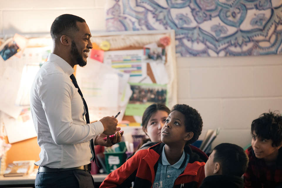 School of Education graduate Martin Odima, a teacher at Frost Lake Elementary School, works with fifth graders in St. Paul. Odima was a member of the School of Education’s Grow Your Own program.