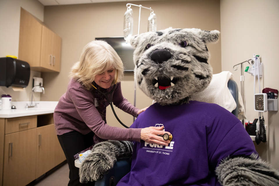 Tommie gets a checkup from Dr. Marilee Votel-Kvaal during the grand opening of the new Center for Well-Being on February 12, 2020, in St. Paul.