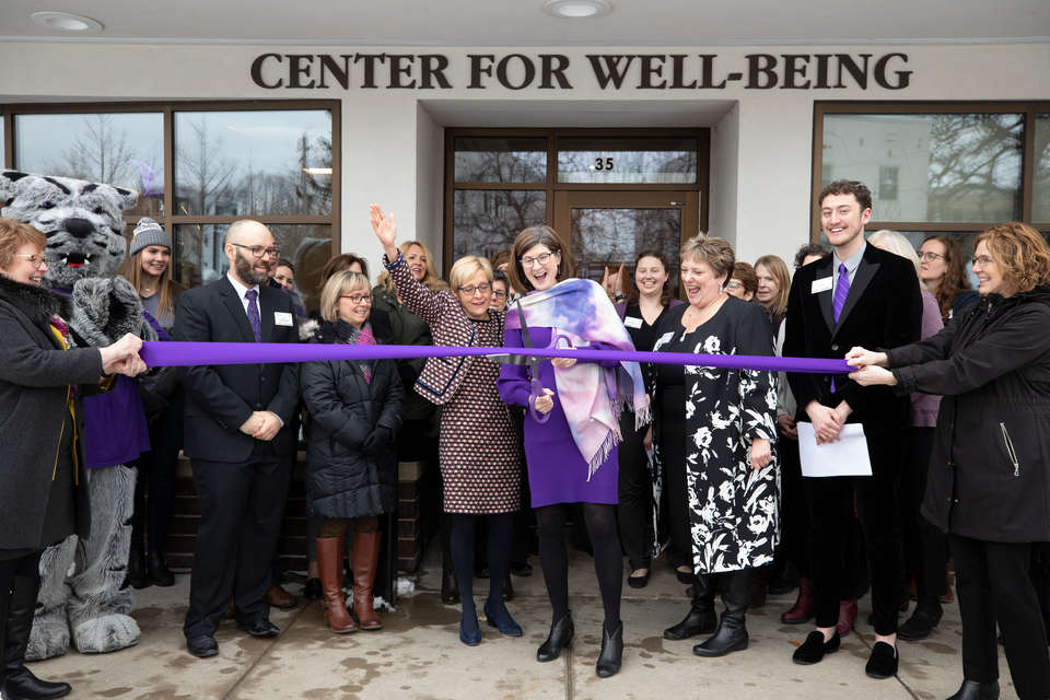 Madonna McDermott, executive director of the Center for Well-Being, and President Julie Sullivan participate in a ribbon cutting during the grand opening of the new Center for Well-Being on February 12, 2020, in St. Paul.