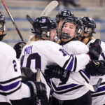 The St. Thomas women’s hockey team celebrates a goal against St. Catherine University. Liam James Doyle/University of St. Thomas