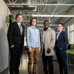 Spring Engineering Senior Design team members Charles Anderson, Ebenezer Dadson, Andrew Elliott, Tony Pham pose for a group photo in the Facilities and Design Center. Mark Brown/University of St. Thomas