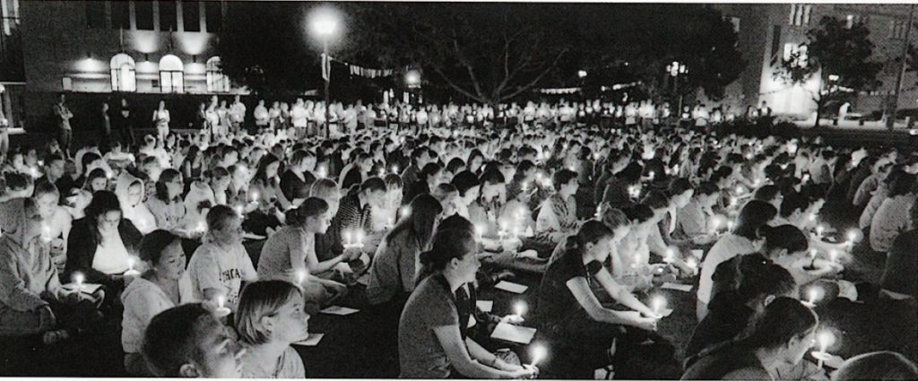 Students sit in the lower quad during a vigil following the Sept. 11, 2001 attacks.