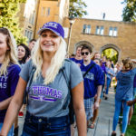 Students, including Tatum Manning (left) and Montanna Edling smile during the March Through the Arches September 8, 2016.