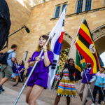 International students carry their flags through the Arches during the March Through the Arches event September 8, 2016.