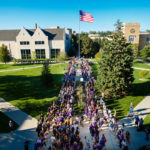 Freshmen stream across the lower quad during the March through The Arches ceremony on September 8, 2016.