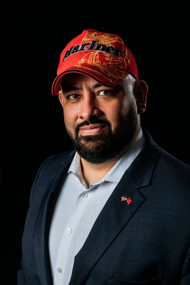 St. Thomas School of Law alum Eddie Ocampos, a veteran of the Marines, poses for a studio portrait in St. Paul on March 13, 2020.