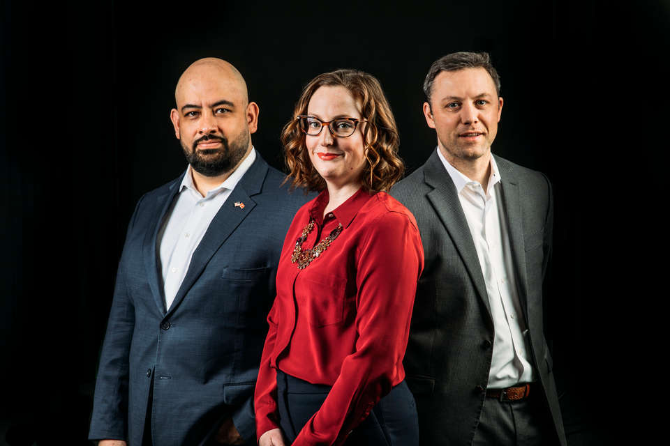 St. Thomas School of Law alums Eddie Ocampo, Jill Sauber and David Best pose for a studio portrait in St. Paul on March 13, 2020.