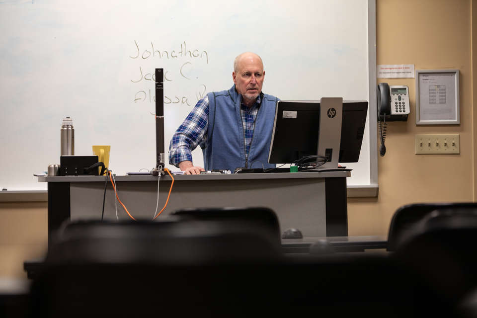 Business Professor Kurt Hochfeld conducts a virtual class in an otherwise empty classroom in McNeely Hall on March 19, 2020.