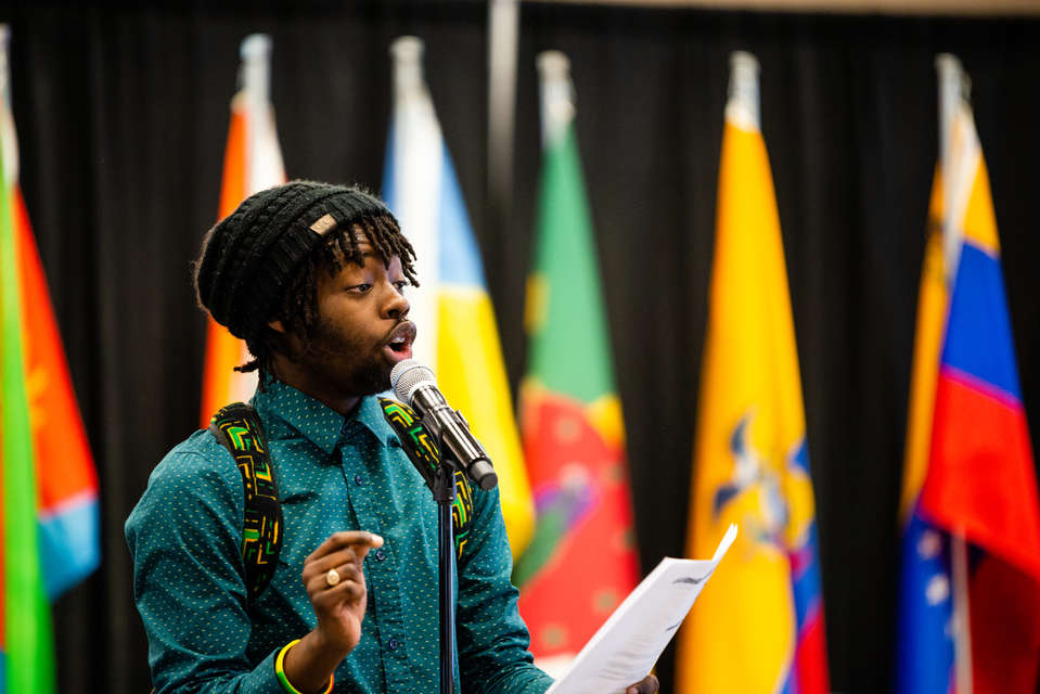 Keanu Daley performs his poem about Jamaica during the 29th Annual International Dinner in the Anderson Student Center, Woulfe Alumni Hall, on Saturday, April 14, 2018.