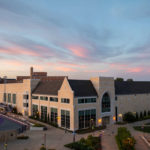 The Anderson Athletic and Recreation Center is pictured under glowing pink skies. Mark Brown/University of St. Thomas