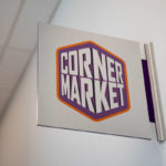 A sign for the Corner Market in Tommie North Residence Hall.