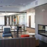 A common area with a fireplace in Tommie North Residence Hall.