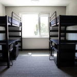 A residence room with beds in Tommie East Residence Hall.
