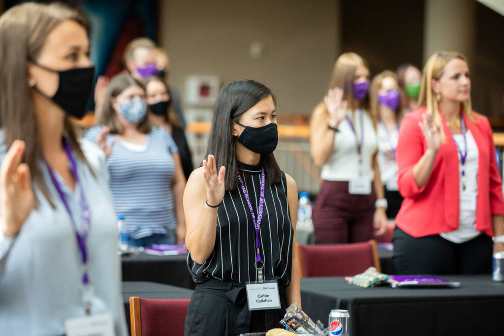 Students pledge an oath during the School of Law’s new student orientation program in the Schulze Grand Atrium in Minneapolis. Liam James Doyle/University of St. Thomas