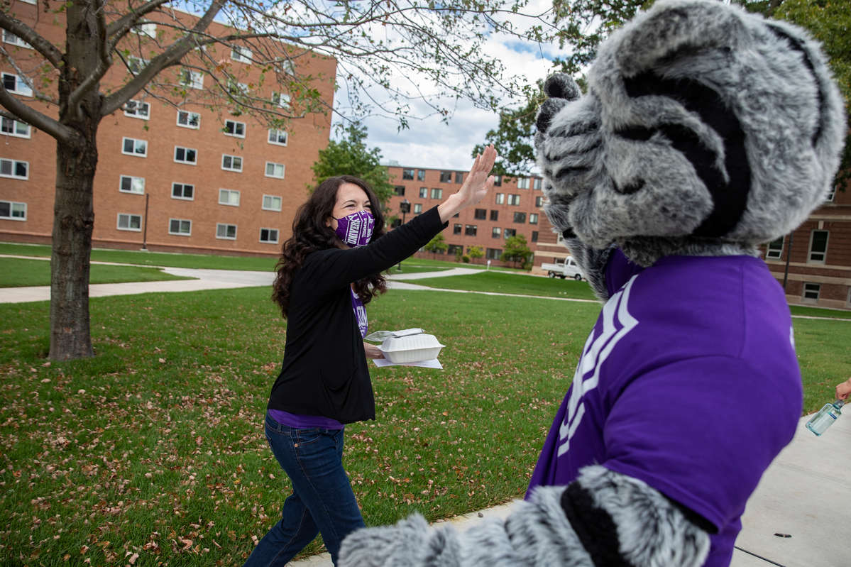 Tommie gets a high five from a staff member on September 4, 2020, in St. Paul.