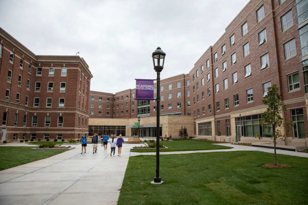 Students walk toward the newly constructed Tommie North Residence Hall.