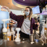 Junior Emma Keller prepares coffee drinks at The Loft in the Anderson Student Center. Liam James Doyle/University of St. Thomas