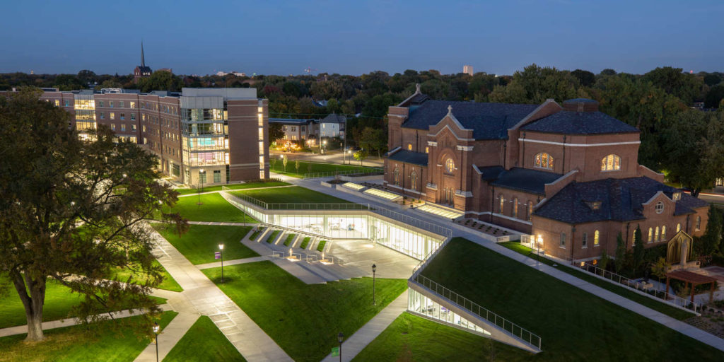 A wide view of the upper quad featuring the Iversen Center for Faith, Aquinas Chapel and Tommie North Residence Hall as photographed at dusk on the rooftop of Brady Hall in St. Paul on September 29, 2020.