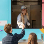 Students get food from Gray Duck Concessions food truck on October 9, 2020, in St. Paul. The Food Trucks were on campus as part of 2020 Homecoming celebrations. Mark Brown/University of St. Thomas