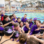 The St. Thomas swim and dive team cheers together during the men's and women's MIAC swimming and diving championship at the U of M Aquatic Center in February. Liam James Doyle/University of St. Thomas