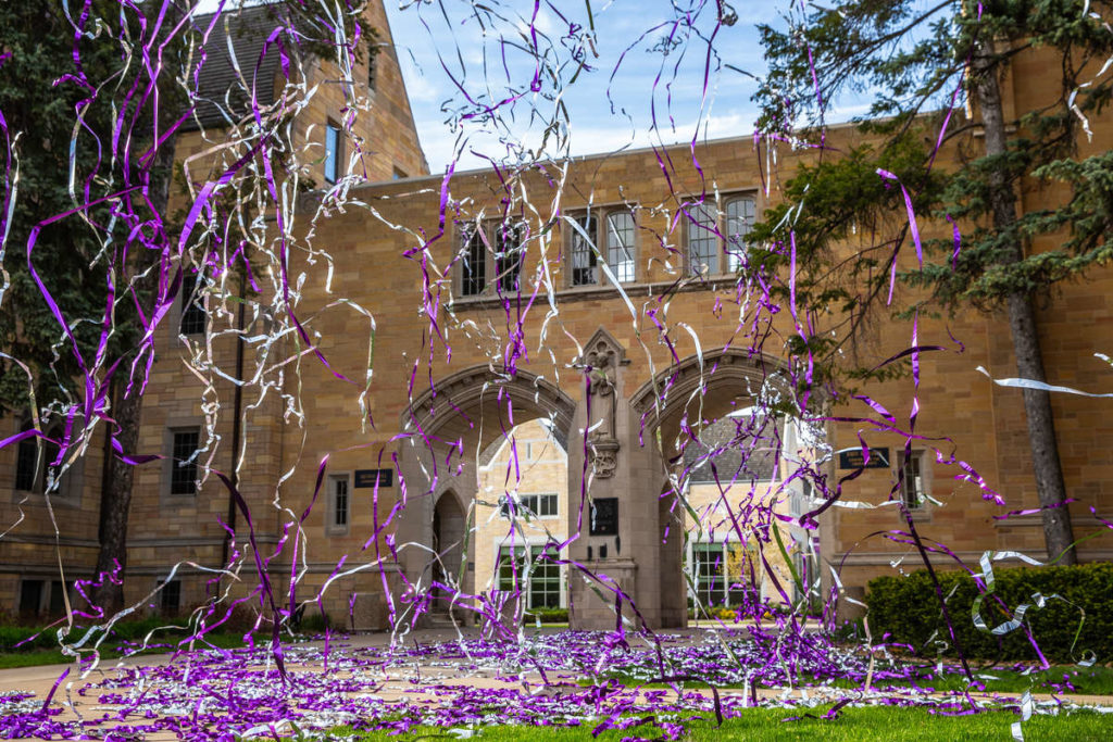Confetti canons shooting and exploding over the Arches in celebration of the 2020 graduating class in lieu of an in-person commencement ceremony due to the coronavirus pandemic. Mark Brown/University of St. Thomas